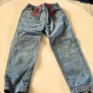 Mini Biden heart with polka dot jeans.